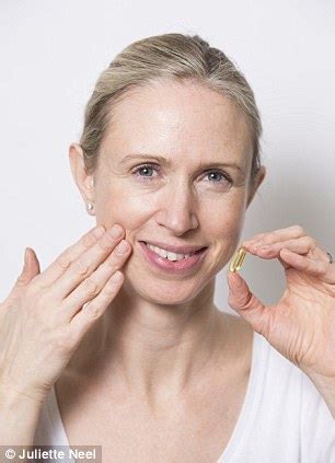 rubbing fish oil on skin.